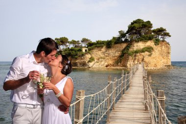 Bride and groon on a bridge clipart