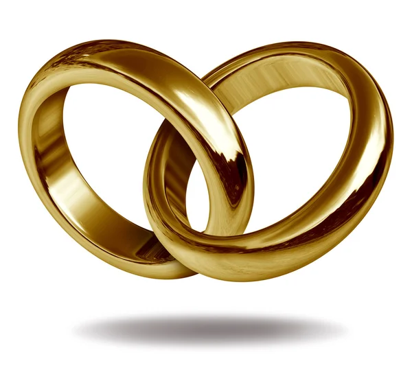 Любовные кольца в золотом сердце — стоковое фото