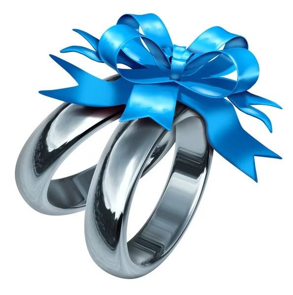Anillos de boda con un arco de regalo azul —  Fotos de Stock