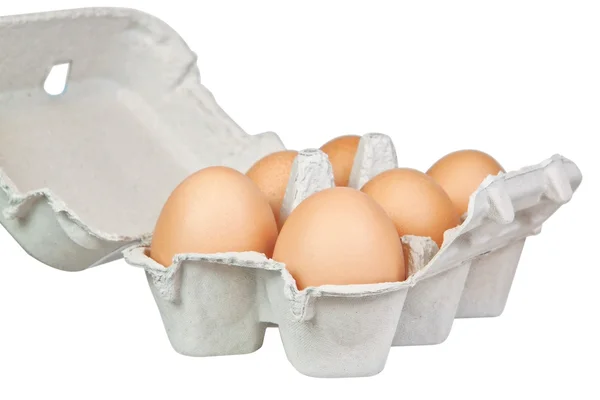 Tray yellow eggs. On a white background. — Stock Photo, Image