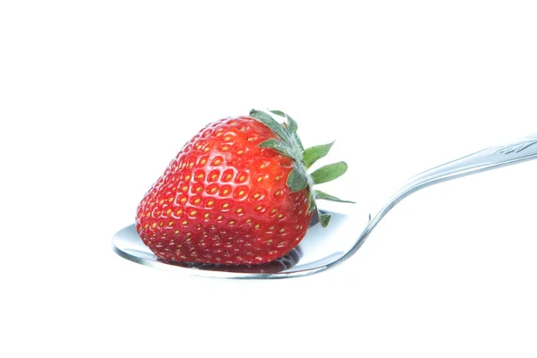 Fresh strawberry on a spoon. On a white background. — Stock Photo, Image