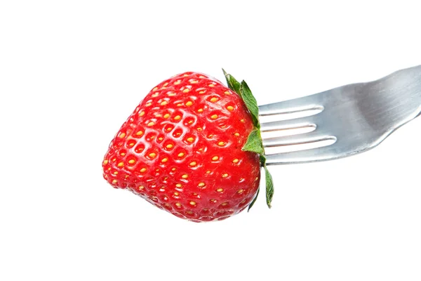 Fresh strawberry on a fork. On a white background. — Stock Photo, Image