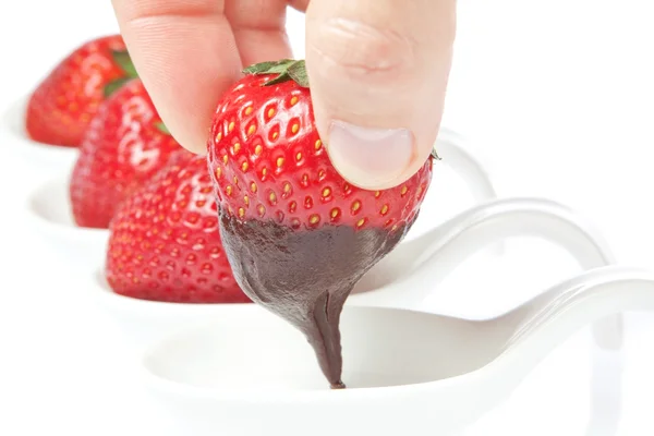 Strawberry in liquid chocolate. On a white background. — Stock Photo, Image