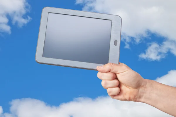 The new tablet in his hand against the sky.