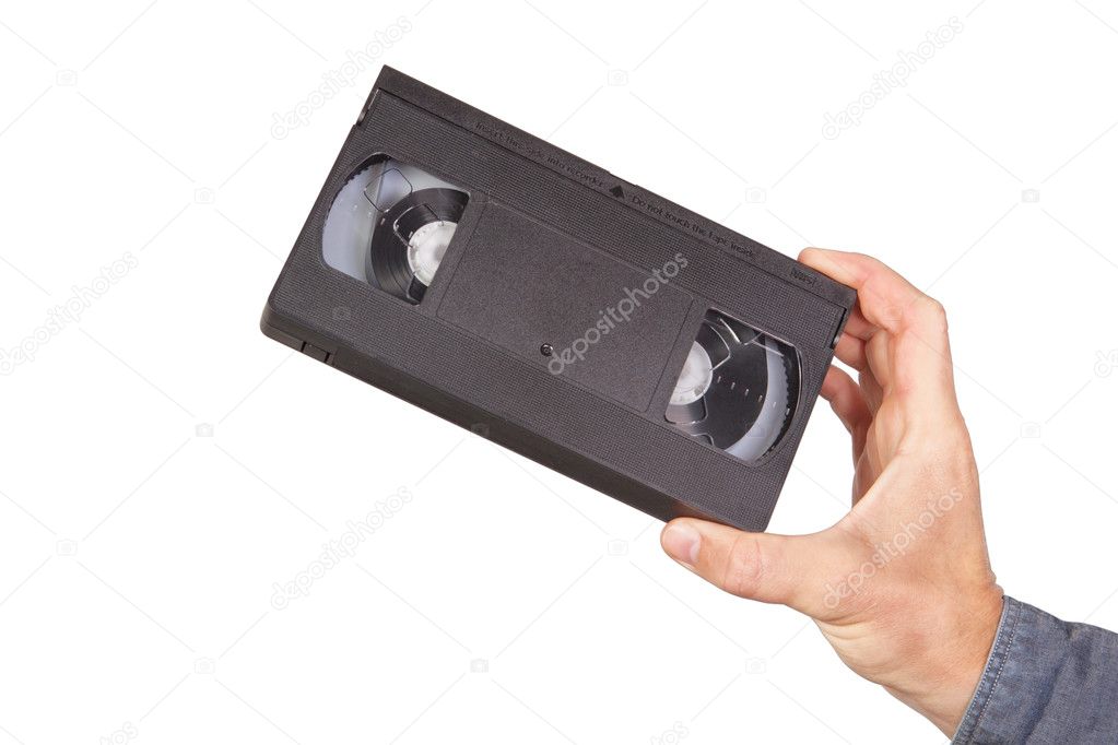Videotape, videocassette in hand. On a white background.