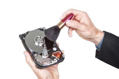 Cleaning open hard disk with brush. On a white background. clipart