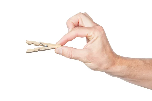 Clothespin in his hand clutched in his fingers .. On a white bac — Stock Photo, Image
