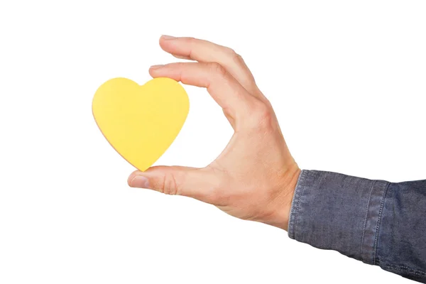 La forma del cuore in mano. su uno sfondo bianco. — Foto Stock
