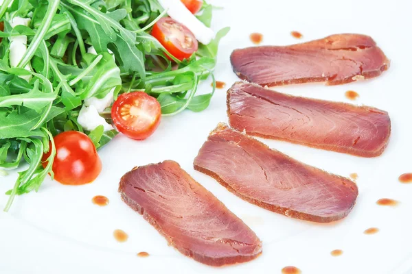 The composition of the slices of smoked tuna. — Stock Photo, Image