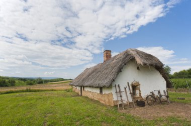 Old farm house with bicycle clipart