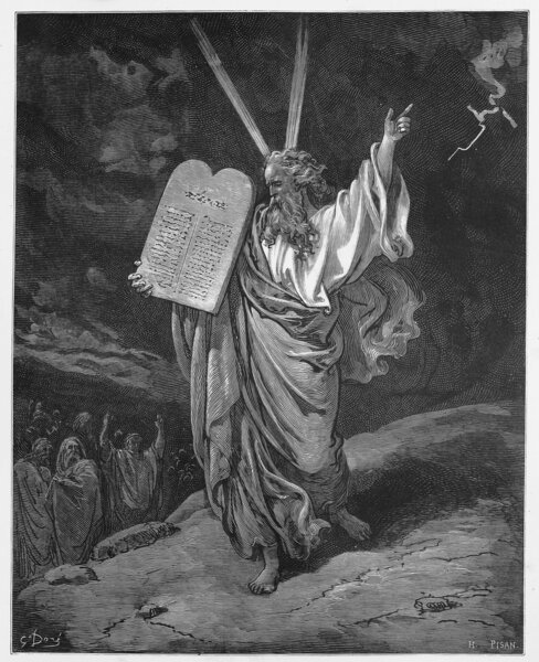 Moses comes down from the mountain with the tablets of Law