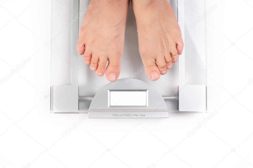 Woman takes her weight on white