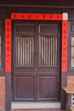 Chinese door with red spring festival couplets clipart