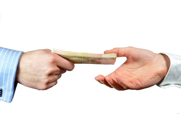 Hand giving stack of euros — Stock Photo, Image