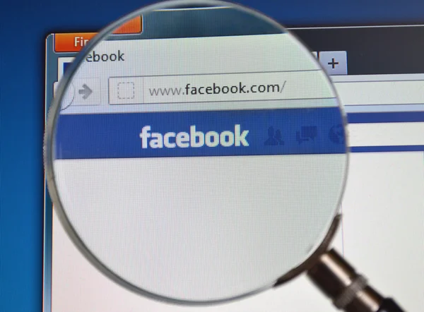 stock image Facebook search with magnifying glass