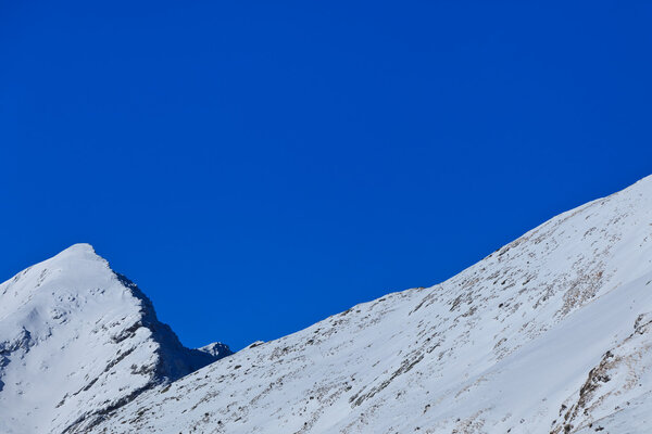 Winter mountain landscape with a blue sky, Fagaras Mountains, Romania