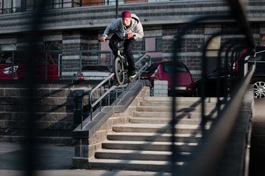 Biker doing double peg grind clipart