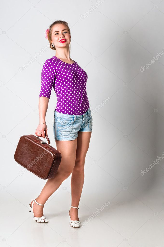 Pin up girl standing with bag