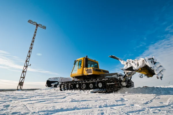 Stock image Snowcat on top of the mountain