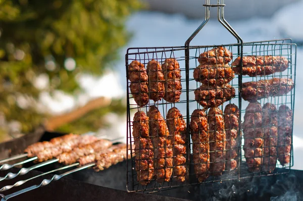 Stock image Cooking sausages on grill