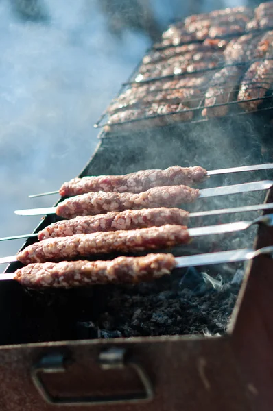 stock image Cooking sausages on skewers