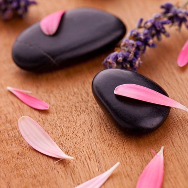 Black stones with leaves and lavender clipart