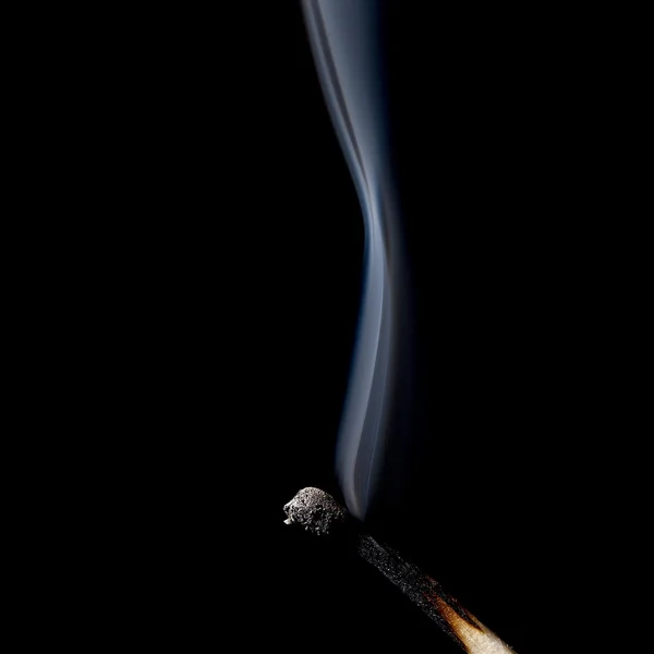 An inflamed match with smoke — Stock Photo, Image