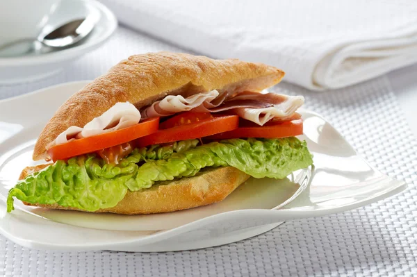 Sandwich with ham, cheese, tomatoes. — Stock Photo, Image
