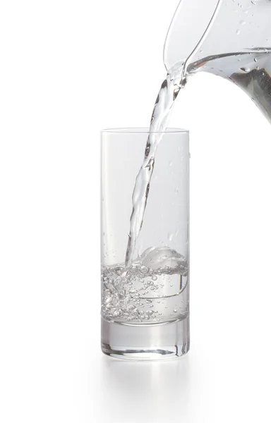Water pouring into glass Isolated on white — Stock Photo, Image