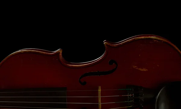 Old scratched violin isolated on black — Stock Photo, Image