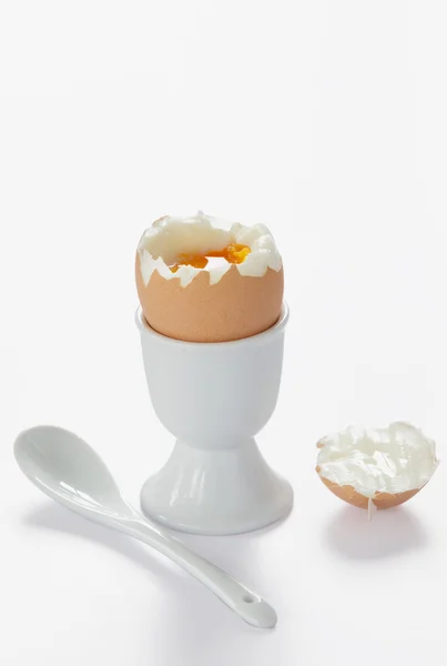 stock image A boiled egg in cup with spoon