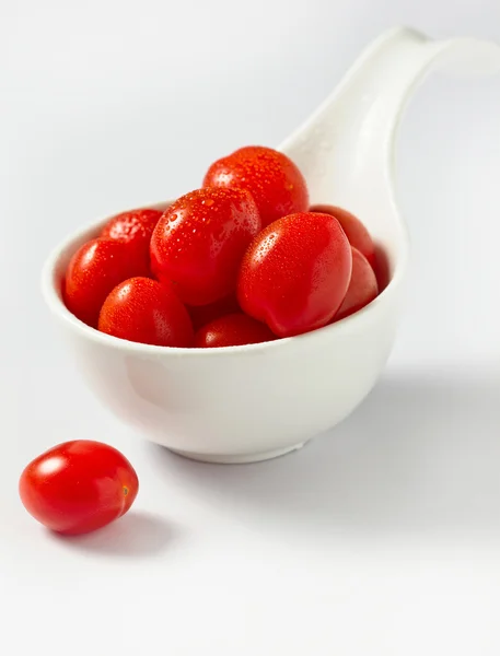 The tomatoes on white background — Stock Photo, Image