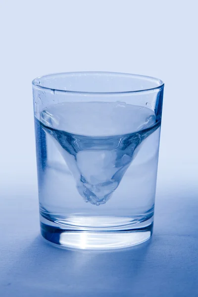 Glass of wather iIsolated on blue background — Stock Photo, Image