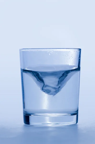 Glass of wather iIsolated on blue background — Stock Photo, Image