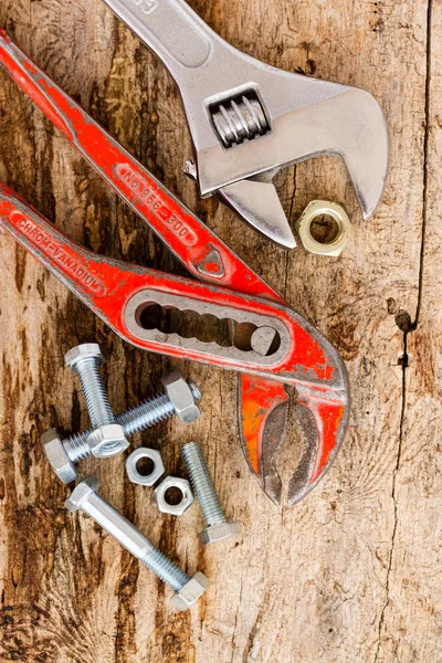Two old, adjustable wrench and set of nuts bolts — Stock Photo, Image