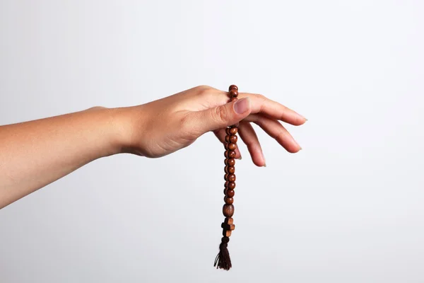 A hand and rosary — Stock Photo, Image