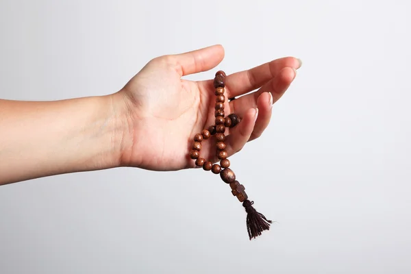 Una mano e un rosario Immagini Stock Royalty Free