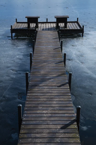 stock image Pier on frozen lake