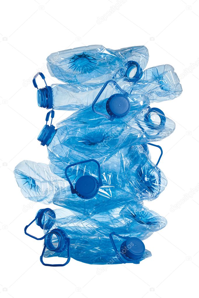 Stack of used blue plastic bottles isolated on white background