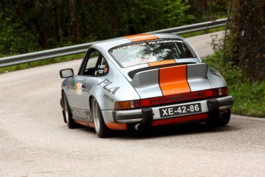 LEIRIA, PORTUGAL - APRIL 20: Pedro L Antunes drives a Porsche 911 during Day One of Rally Verde Pino 2012, in Leiria, Portugal on April 20, 2012. clipart