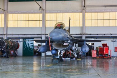 MONTE REAL, PORTUGAL-APRIL 7: F-16 Portuguese on hangar for maintenance on clipart