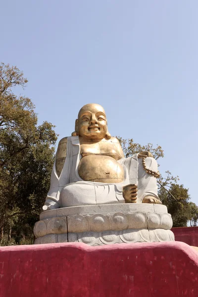 Úsměv bronz buddha — Stock fotografie