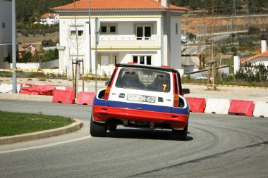 CASTELO BRANCO, PORTUGAL - MARCH 10: Anibal Rolo drives a Renault 5 Turbo during Rally Castelo Branco 2012, integrated on Open Championship in Castelo Branco, Portugal on March 10, 2012. clipart