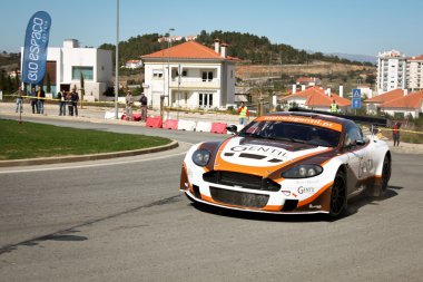 CASTELO BRANCO, PORTUGAL - MARCH 10: Jorge Santos drives a Aston Martin Vantage during Rally Castelo Branco 2012, integrated on Open Championship in Castelo Branco, Portugal on March 10, 2012. clipart