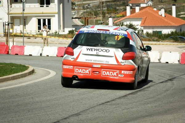 CASTELO BRANCO, PORTUGAL - MARCH 10: Salvador Gonzaga drives a Peugeot 206 GTI during Rally Castelo Branco 2012, integrated on Open Championship in Castelo Branco, Portugal on March 10, 2012. — Stock Photo, Image