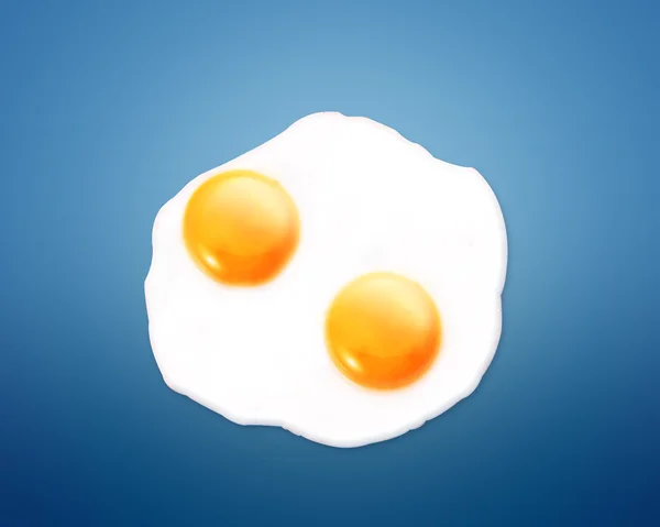 Fried egg on Blue background — Stock Photo, Image