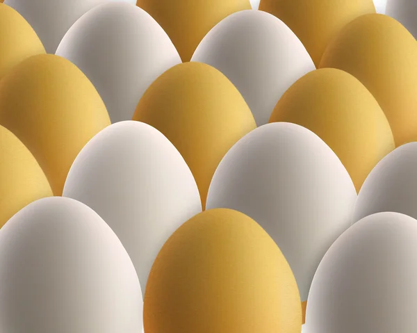 Set of golden and white eggs — Stock Photo, Image