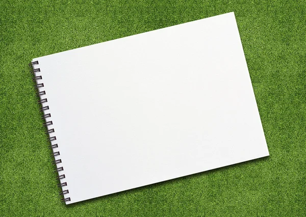 Notebook on grassland — Stock Photo, Image
