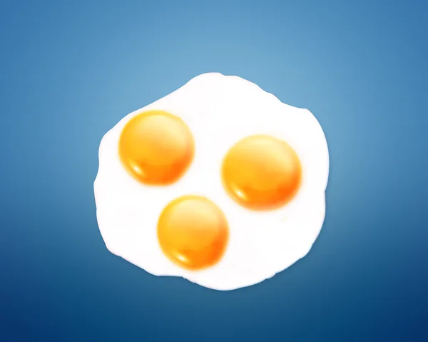 Fried egg on orange background — Stock Photo, Image