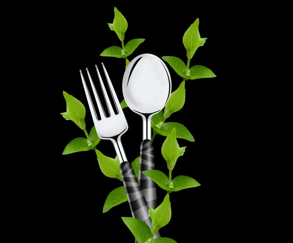 Foglie verdi intorno a forchetta e cucchiaio — Foto Stock